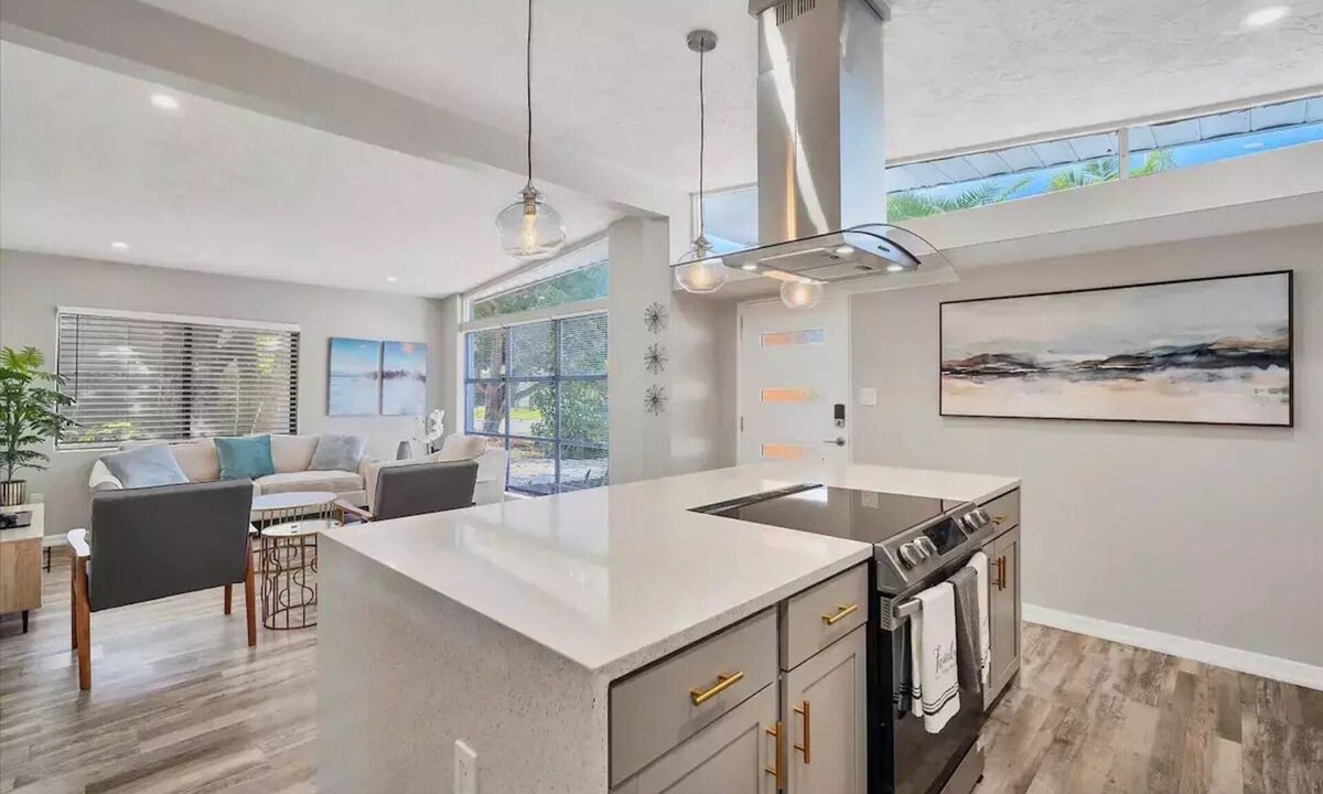 Bayshore Gardens House | Bayshore Gardens remodel with hot tub + fire pit + walk to park.