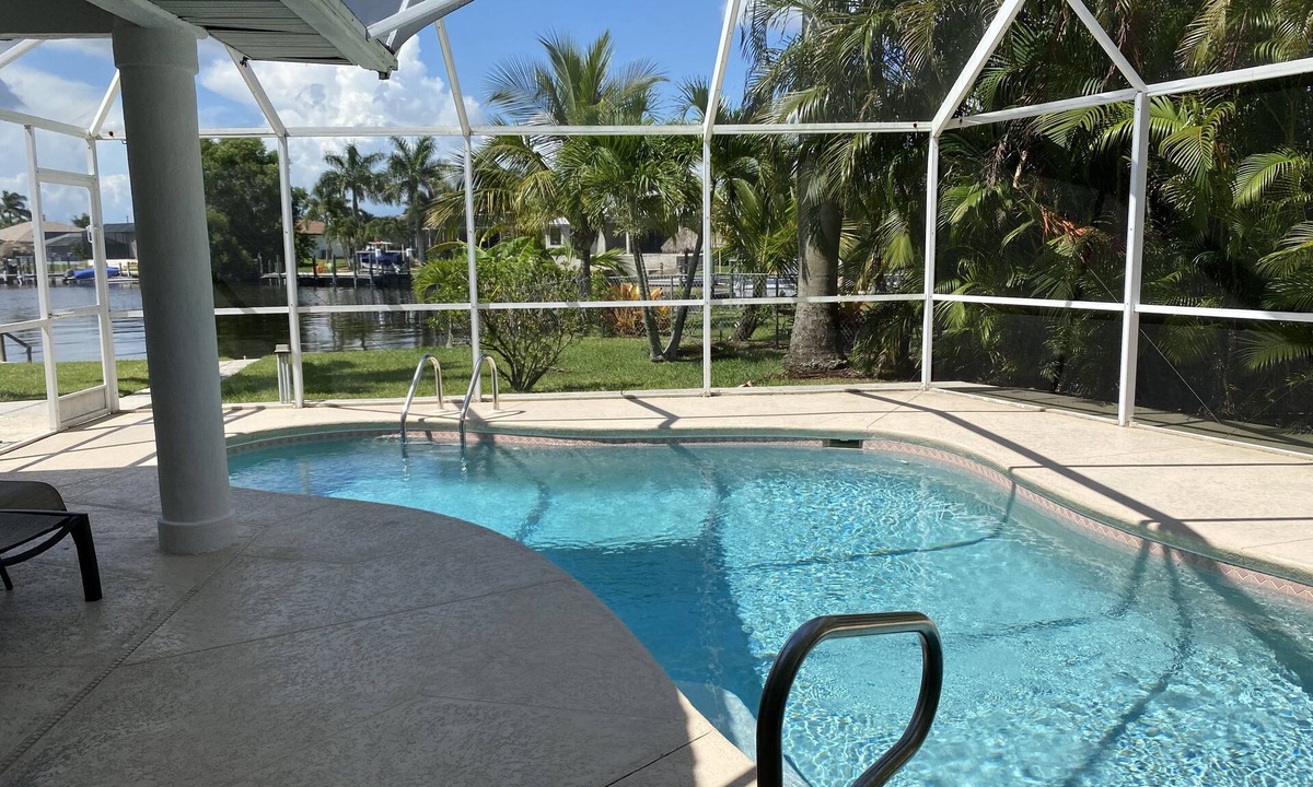 Pelican Villa | Beautiful Gulf access canal views with heated pool.