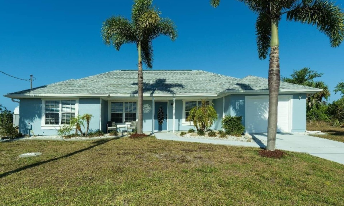 South Gulf Cove House | Canal Dreams a Gorgeous 3 BR/2 BA home with heated pool on the canal