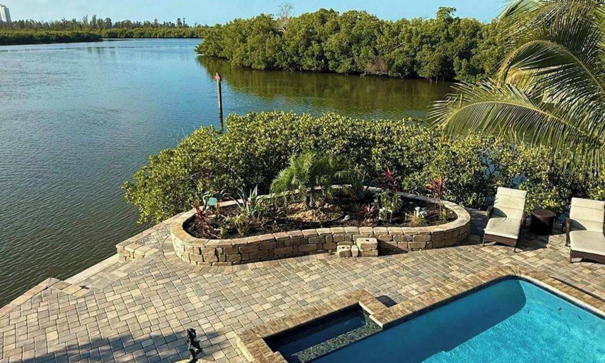 Estero Bay Shores House | Immaculate bay front home w/in ground pool, spa, paver patio & porch