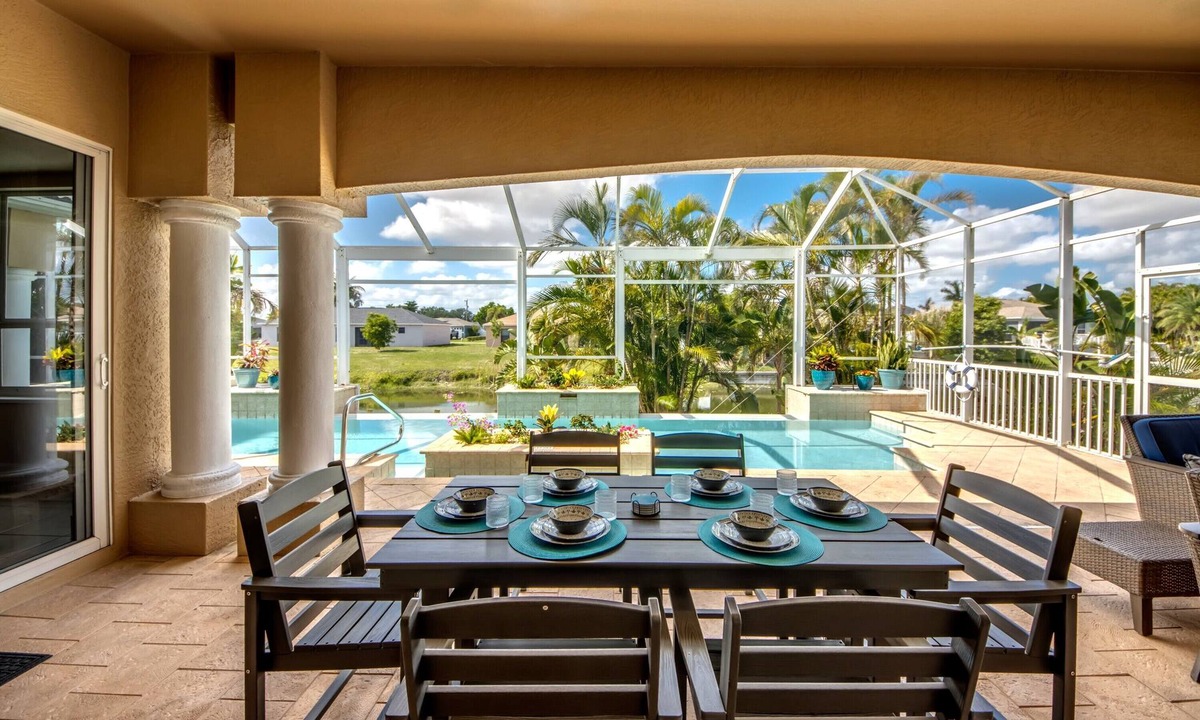 Fort Myers Villa | The Grand Colonnade - Ample 3 BR/3 bath waterfront Villa with 2 suites, heated pool, kayaks, pool table, fishing poles