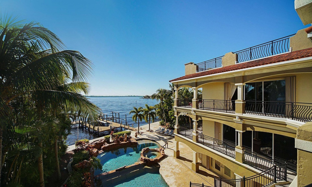 Yacht Club House | The Winslet Estate offers 5BR luxury, waterfront views, pool, spa, and game room - SWFL Rentals