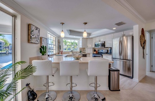 Caloosahatchee House | 2 Waterfront Villas, Dual Pools, Gulf Access & Tiki Hut Escape - Everlasting Paradise - Roelens