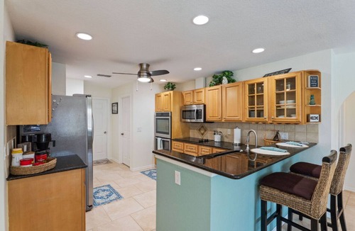 Pelican House | 25 Min to Fort Myers Beach, Canal front, large heated pool: Dive into Relaxation