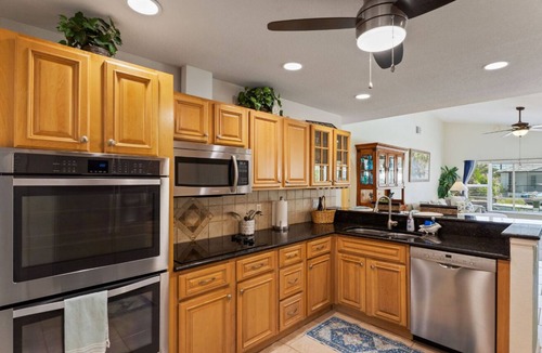 Pelican House | 25 Min to Fort Myers Beach, Canal front, large heated pool: Dive into Relaxation