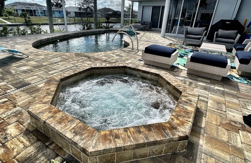South Gulf Cove House | 4 Bedroom Gulf Coast Waterfront Paradise with heated pool, hot tub & Boat Dock!