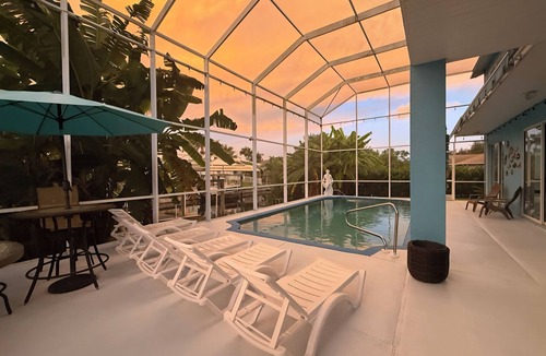Cape Coral Villa | 4-bedroom, pool, fishing, games, BBQ, kayak and front water.