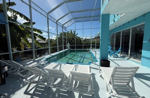 Cape Coral Villa | 4-bedroom, pool, fishing, games, BBQ, kayak and front water.