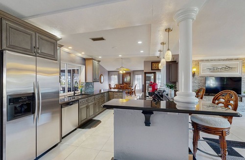 Lochmoor Waterway Estates House | Beautiful, dog-friendly home with in ground pool, putting green & sundeck