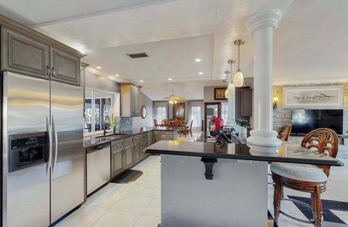 Lochmoor Waterway Estates House | Beautiful, dog-friendly home with in ground pool, putting green & sundeck