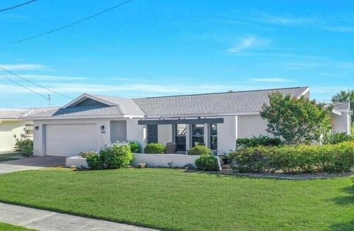 Lochmoor Waterway Estates House | Beautiful Waterfront Home with Heated Pool in Quiet Neighborhood