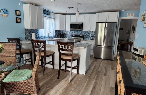 Naples Park House | Beautifully Decorated Beach Cottage with Sparkling Heated Pool