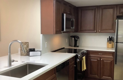 Bonita Bay Condo | Beautifully Renovated Lakeview Corner Condo. Private Beach, Pool and Spa