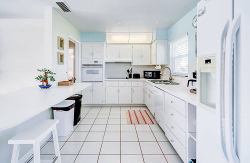Yacht Club House | Cozy 1960s home with heated pool, city & canal located