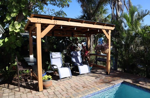 Bayshore Gardens House | Cozy canal cottage with pool, dock, Gulf access and minutes to Anna Maria Island