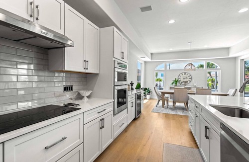 Vanderbilt Beach House | Exquisite waterfront home with lanai, heated pool and spa(hot tub), and internet