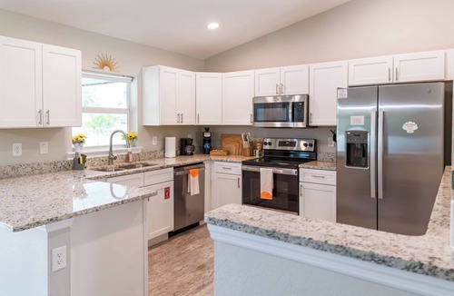 Englewood East House | Family Beach Retreat w/Private Fenced Backyard, Fire Pit, Games