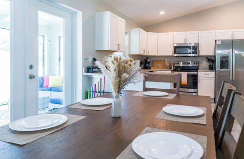Englewood East House | Family Beach Retreat w/Private Fenced Backyard, Fire Pit, Games
