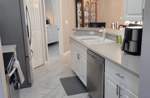 Herons Glen House | Florida Golf Retreat with Tropical Sunroom & Resort Vibes.