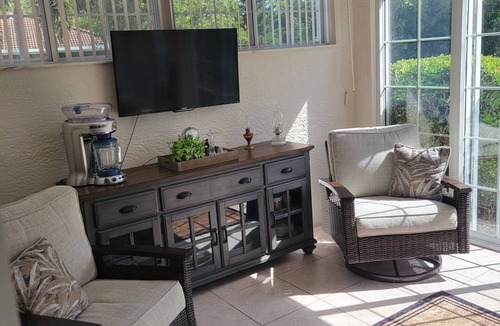 Herons Glen House | Florida Golf Retreat with Tropical Sunroom & Resort Vibes.