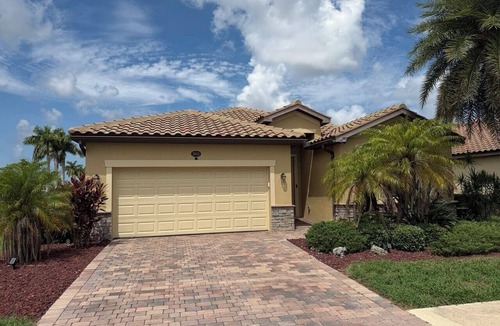 Gran Paradiso House | Gated Tuscan Paradise: 4BR/3BA Home + Lagoon Pool, Tennis & Fitness Club Access