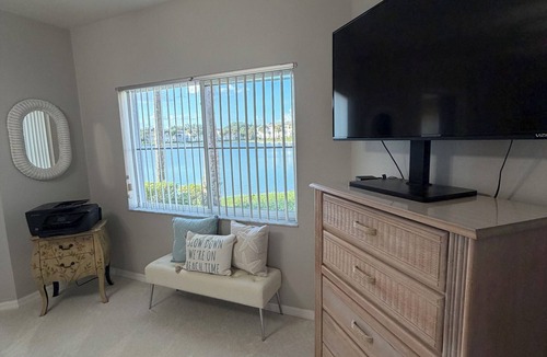 North Naples Condo | GORGEOUS - LAKEFRONT CARRIAGE HOME-1ST FLOOR LIVING-2 BED/2 BATH-2 POOLS