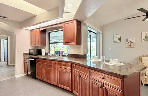 Pebble Beach House | !HEATED POOL/LANAI-BBQ-CANAL WATERFRONT-NEAR BEACH/GOLF/PARK/TENNIS/RESTAURANTS!