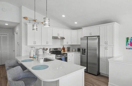 Estero Bay Shores House | Immaculate bay front home w/in ground pool, spa, paver patio & porch