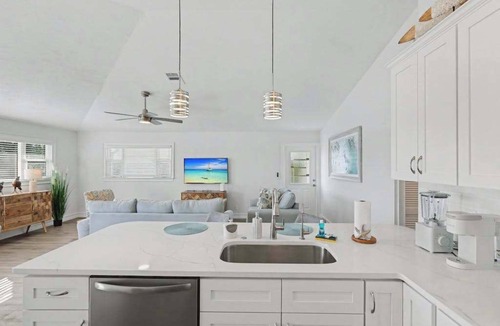 Estero Bay Shores House | Immaculate bay front home w/in ground pool, spa, paver patio & porch