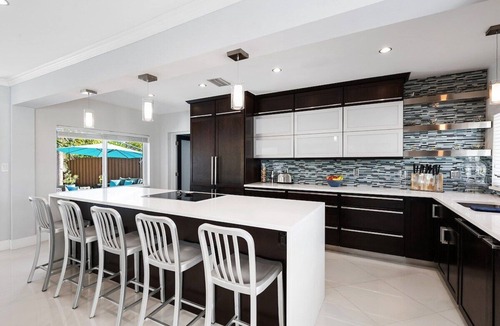 Poinsettia Heights House | Just 10min to downtown Ft. Lauderdale & beach, this modern home offers everything a group could want for an upscale relaxing getaway. Unwind in the very private and peaceful backyard oasis, featuring a heated pool ($), 6-person hot tub & fire pit.