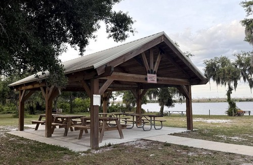 Braden River RV Rental | Luxurious Deluxe Safari Tent with King Bed and Outdoor Fire Pit in Bradenton, Florida