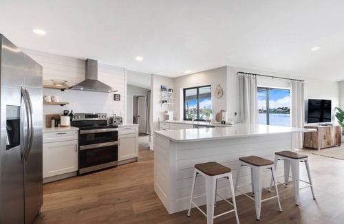 Eight Lakes House | Luxury Gulf-Access Lakefront Retreat | Heated Pool, Spa, Bikes, Kayaks & Dock