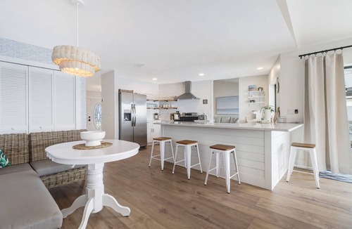 Eight Lakes House | Luxury Gulf-Access Lakefront Retreat | Heated Pool, Spa, Bikes, Kayaks & Dock