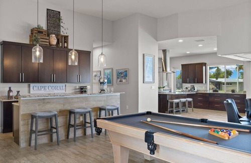 Yacht Club House | Luxury home w/2 suites, LARGE pool, spa, lanai. Quick gulf access! 6 Bikes! EV!