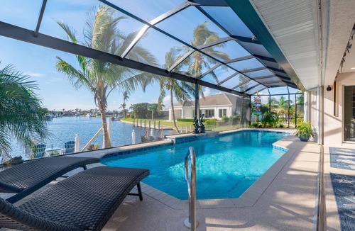 Burnt Store Isles House | Luxury Tropical long waterfront view w/bikes,kayaks,golf clubs,beach gear incl.