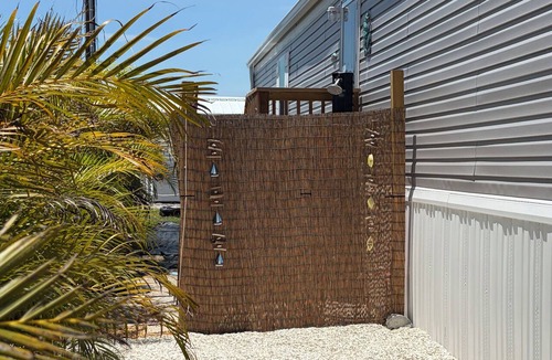 Flamingo Bay House | Manatee Lookout Cottages - Boat to Beach, Dock, Pool, Kayaks, Direct Gulf Access