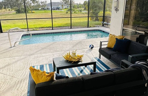 Rotonda Lakes House | Modern luxury Beach house w/free heated pool seating in half acre lot and canal