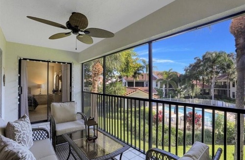 Pelican Bay Condo | Pelican Bay Condo overlooking pool and gardens, with private beach access.