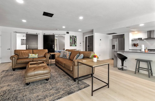 Caloosahatchee House | Pink Pineapple ~ Walk to Downtown ~ Chic Heated Pool Home