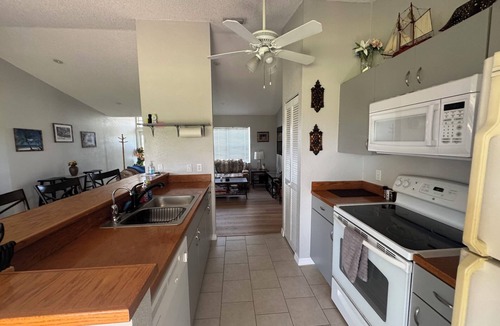 Gardens of Gulf Cove House | Private home, great sunsets over pristine canal. 10 mins to beaches