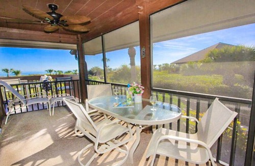 Sanibel Condo | Relax on your private deck with Gulf views Sanibel Island - Pet Friendly - Signal Inn 09
