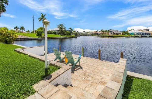 Pelican House | Riverfront Luxury with Heated Pool, Spa & Private Dock - Sunny Shores Escape