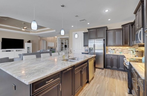 Burnt Store Villa | Tee Times and Tan Lines 1006 4 BR Heated Pool & Spa Retreat on Coral Oaks Golf Course