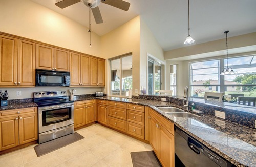 Fort Myers Villa | The Grand Colonnade - Ample 3 BR/3 bath waterfront Villa with 2 suites, heated pool, kayaks, pool table, fishing poles
