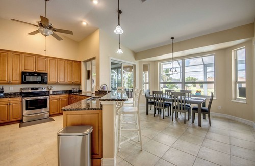 Fort Myers Villa | The Grand Colonnade - Ample 3 BR/3 bath waterfront Villa with 2 suites, heated pool, kayaks, pool table, fishing poles