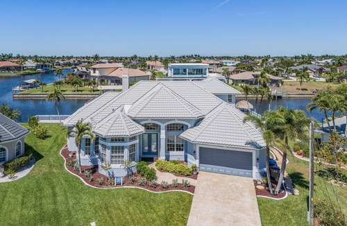 Pelican Villa | This Villa has it all! Waterfront - heated pool, hot tub, boat dock, tiki hut!