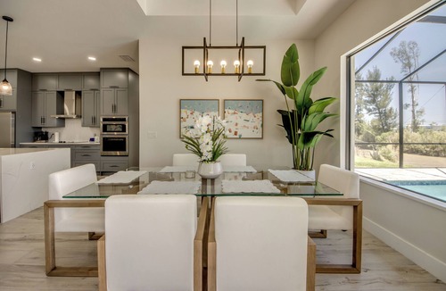 Trafalgar Villa | Villa Paradise - Exquisite 3 Bedroom/3 bath waterfront Villa with heated pool, guest suite, fishing poles