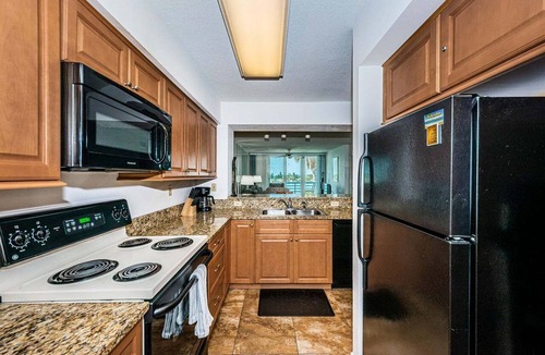 Isla del Sol Condo | Waterfront 2BR/2BA condo with pool, hot tub, beach access, and water views.
