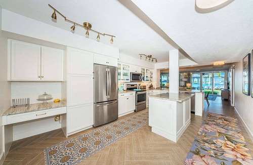 Isla del Sol Condo | Waterfront 2BR condo with pool, hot tub, balcony, and water views.