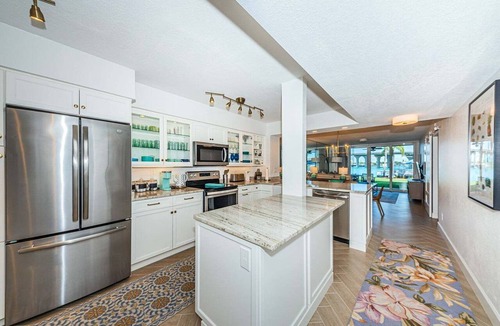 Isla del Sol Condo | Waterfront 2BR condo with pool, hot tub, balcony, and water views.